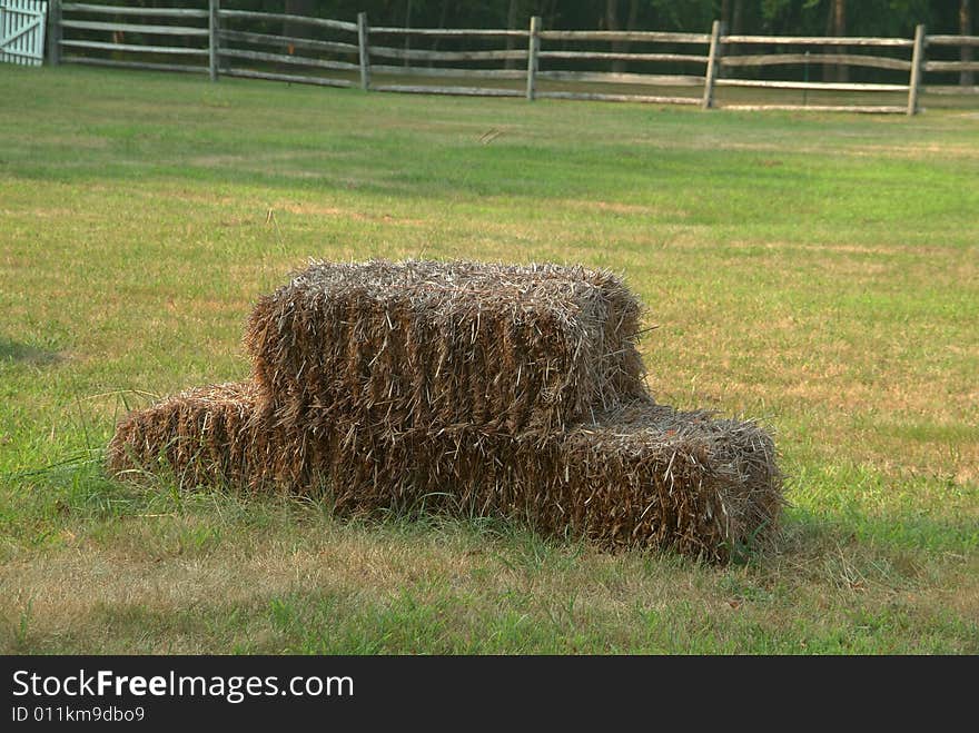 Hay on grass in field