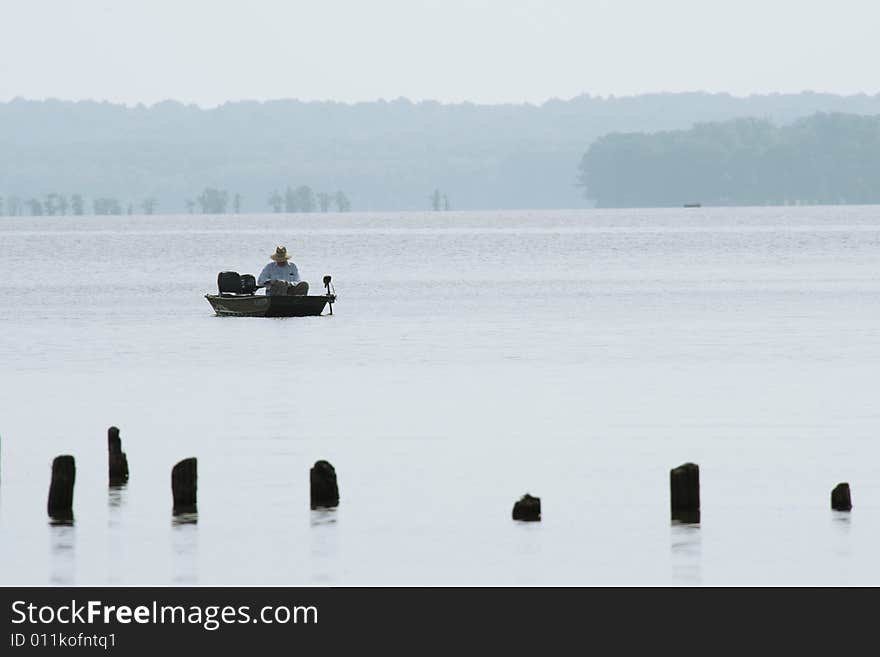 Fisherman In The Mist