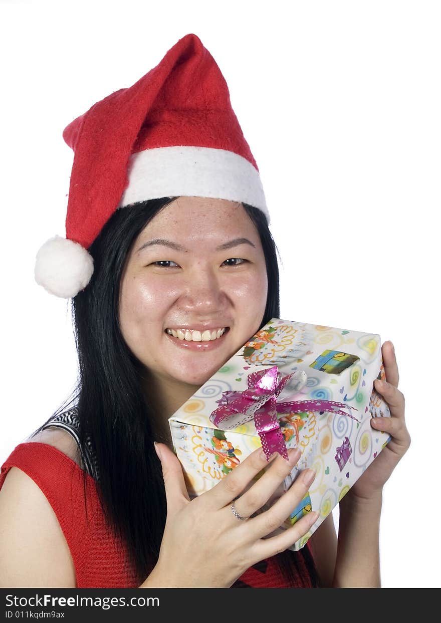 Portrait of a santa girl with hat and gift. Portrait of a santa girl with hat and gift