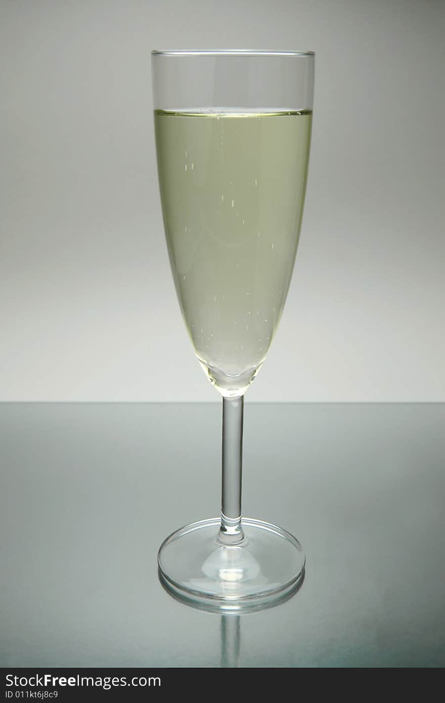 Flutes of sparkling wine isolated against a white background