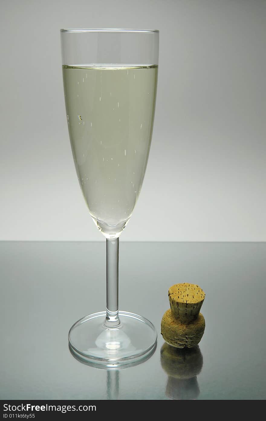 Flutes of sparkling wine isolated against a white background