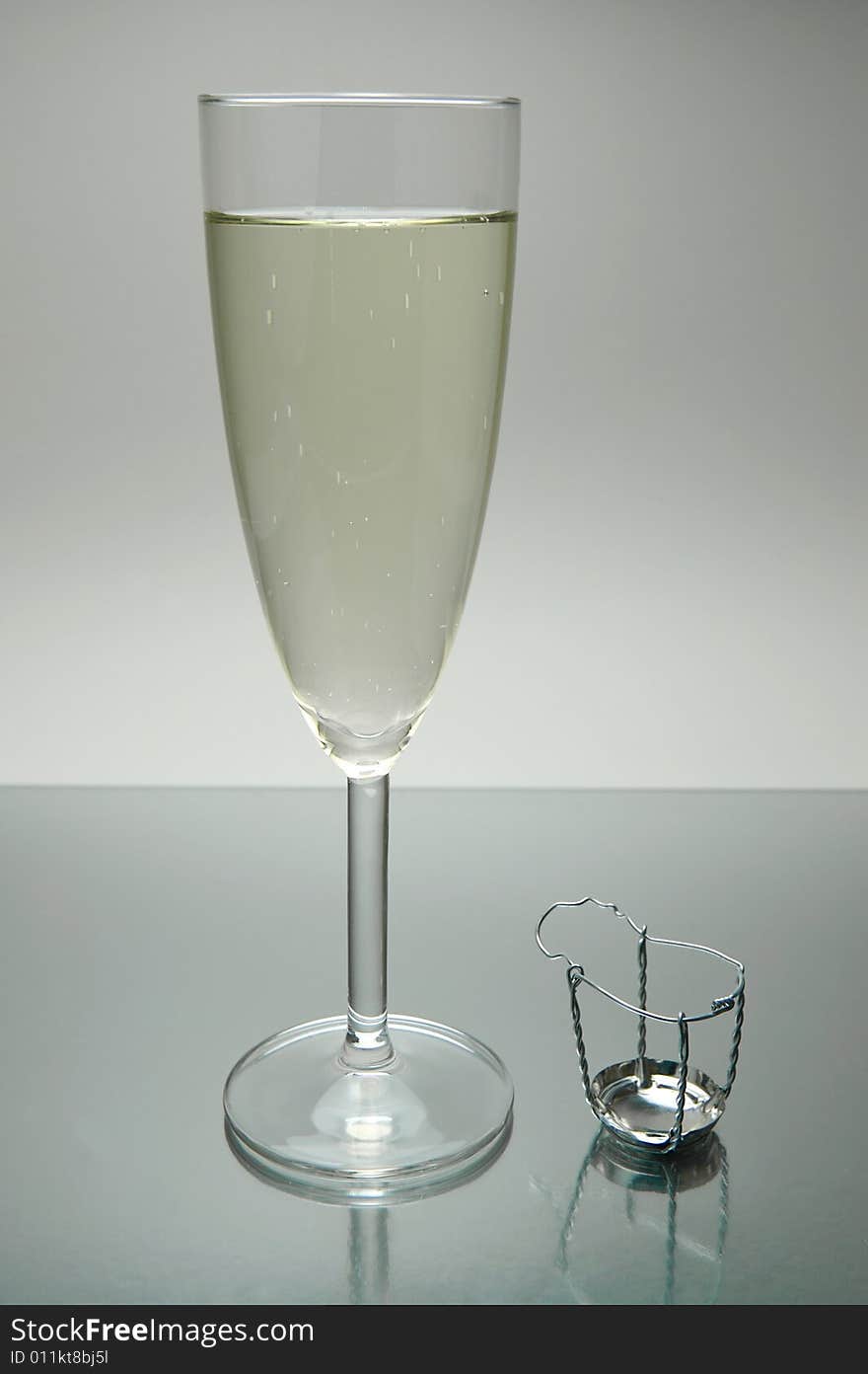 Flutes of sparkling wine isolated against a white background