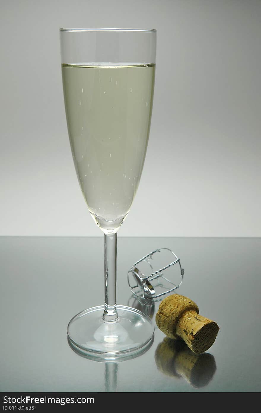 Flutes of sparkling wine isolated against a white background