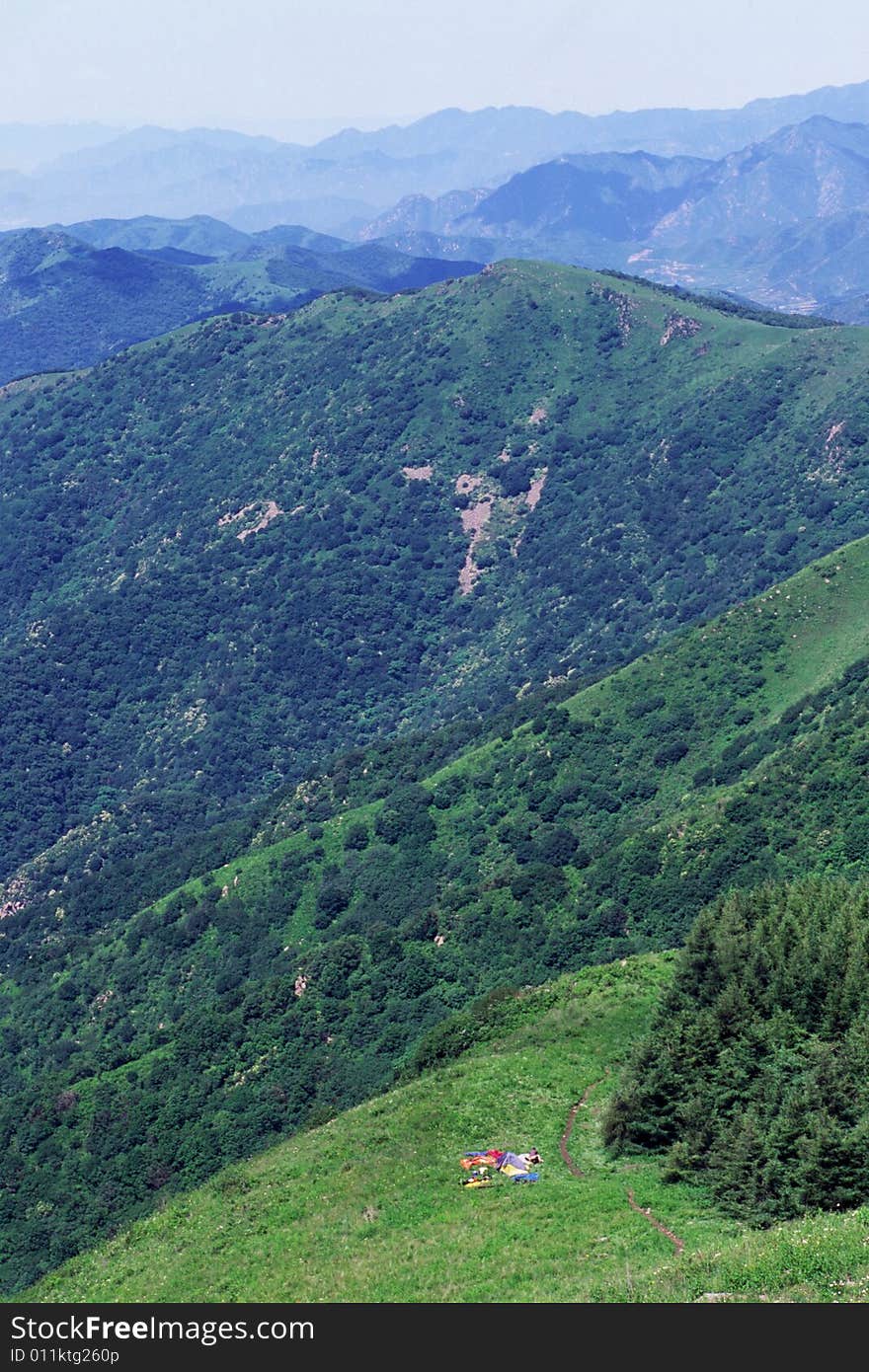 Hiking tents by the woods in the mountains. Hiking tents by the woods in the mountains