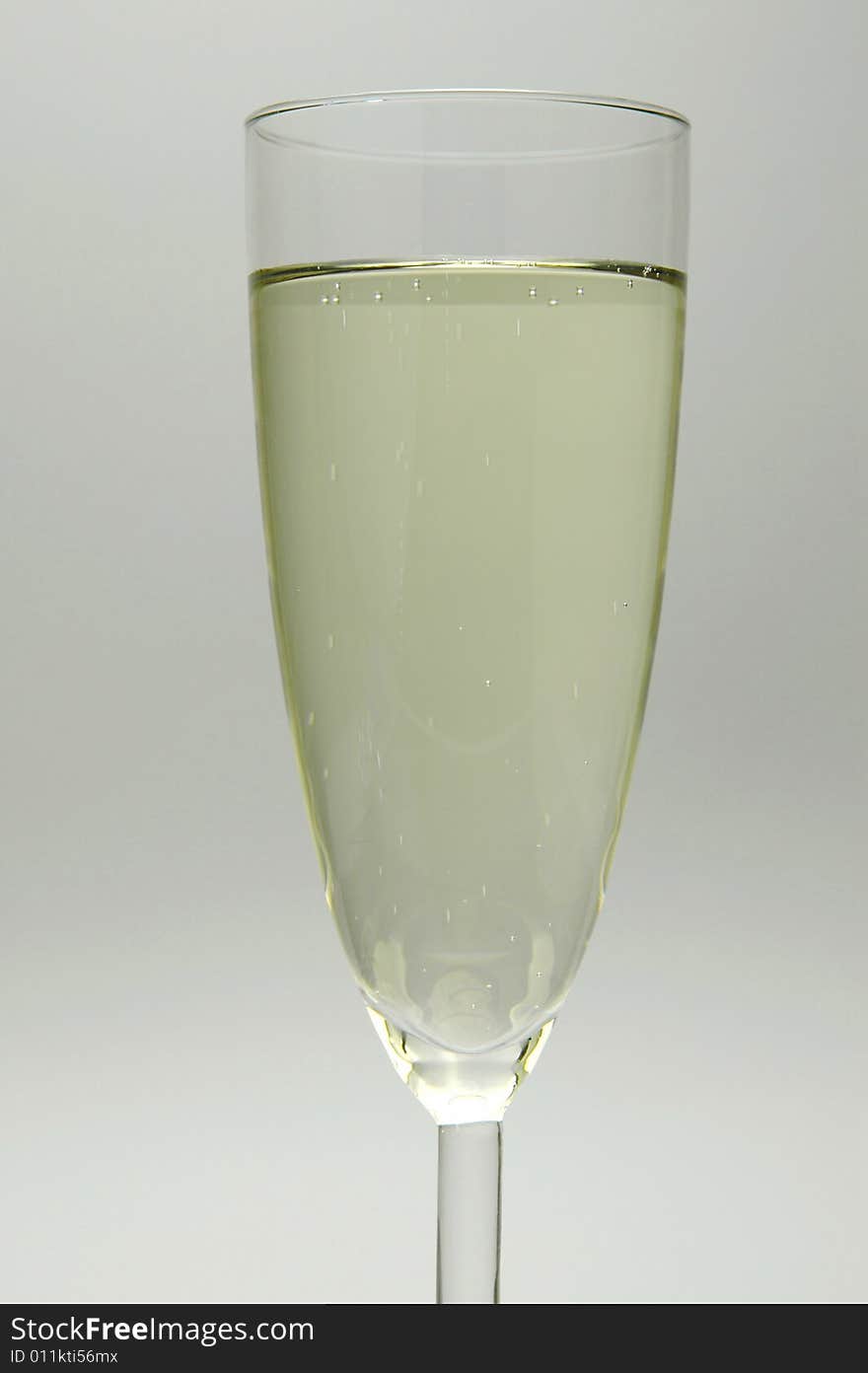 Flutes of sparkling wine isolated against a white background