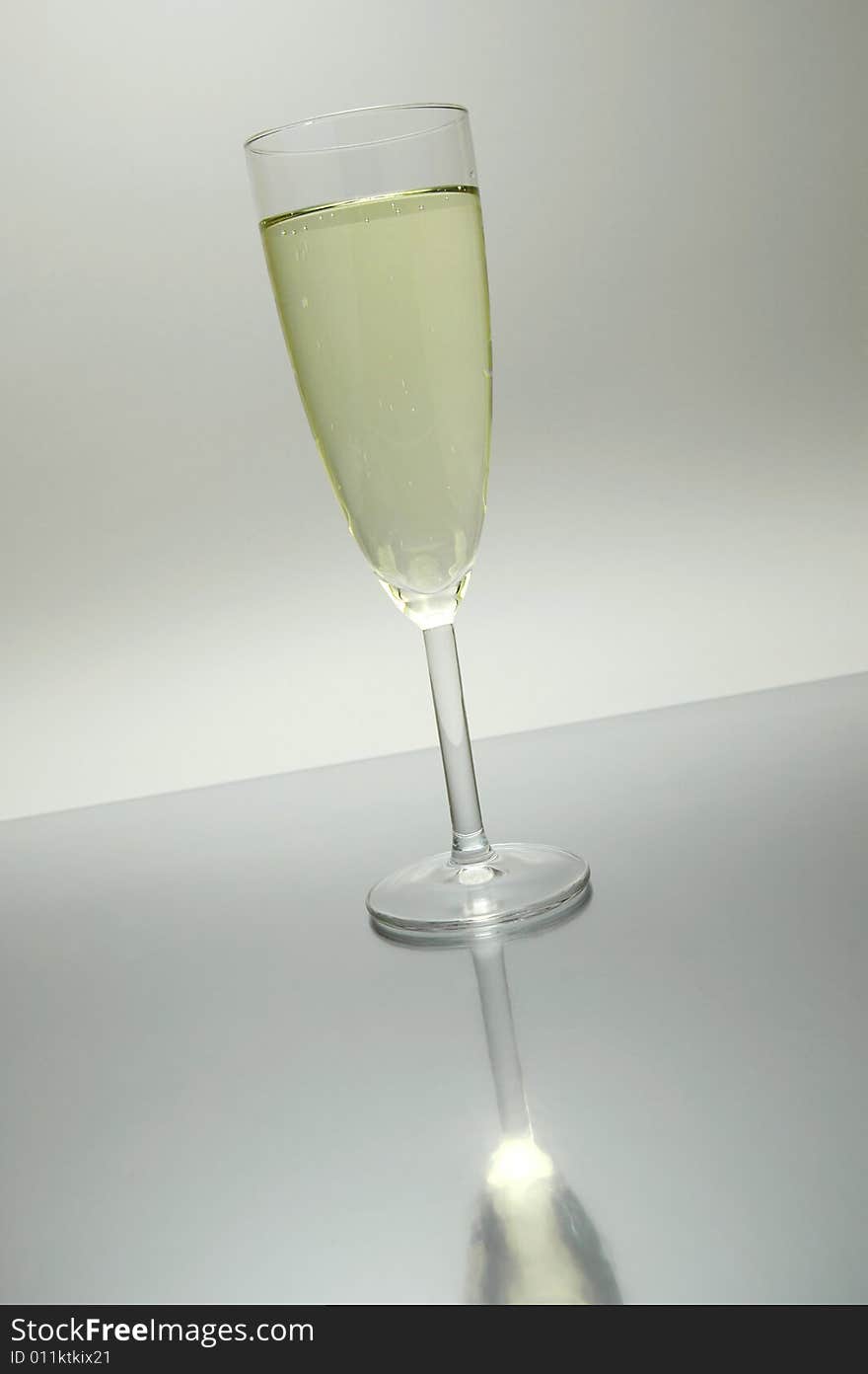 Flutes of sparkling wine isolated against a white background