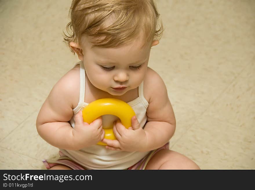 A baby girl having fun playing