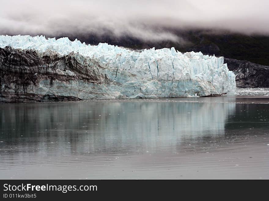 A Blue Alaskan Glacier And Still Waters