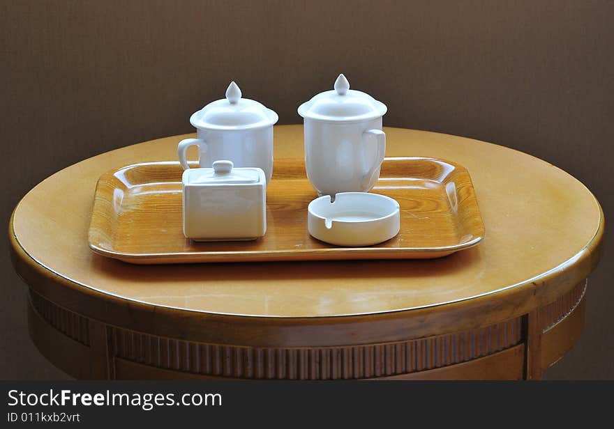 Tea cup and ashtray on the table