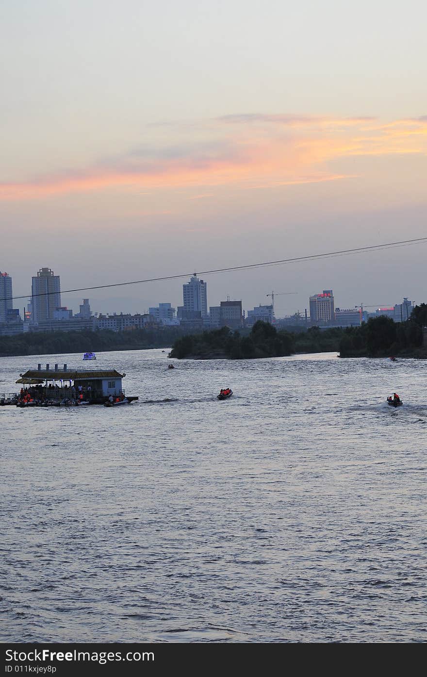 City on the dusk, river and city. City on the dusk, river and city