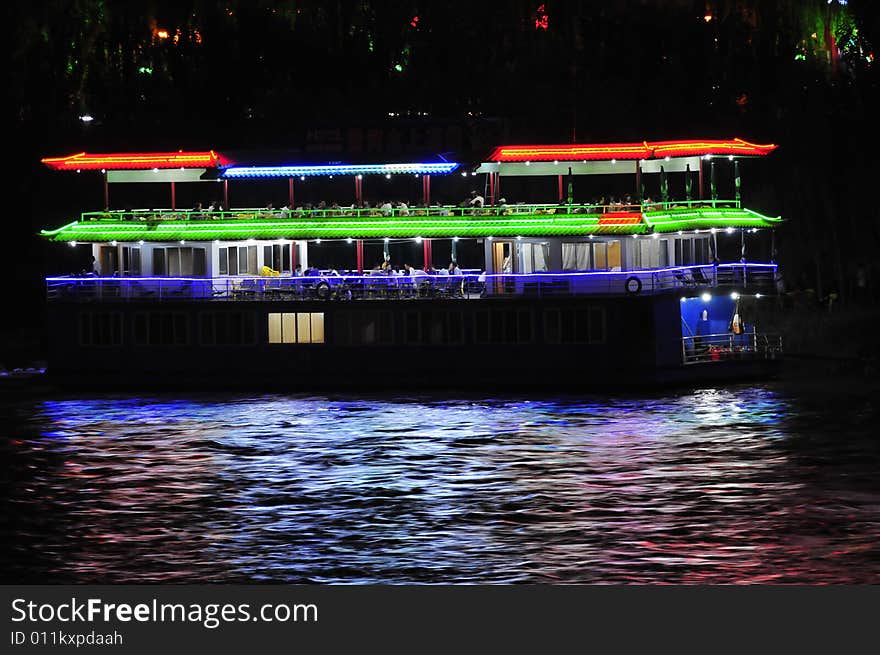 Night scene on the river, lighten the boat