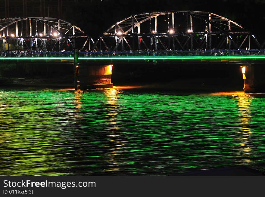 Night scene on the river, steel bridge