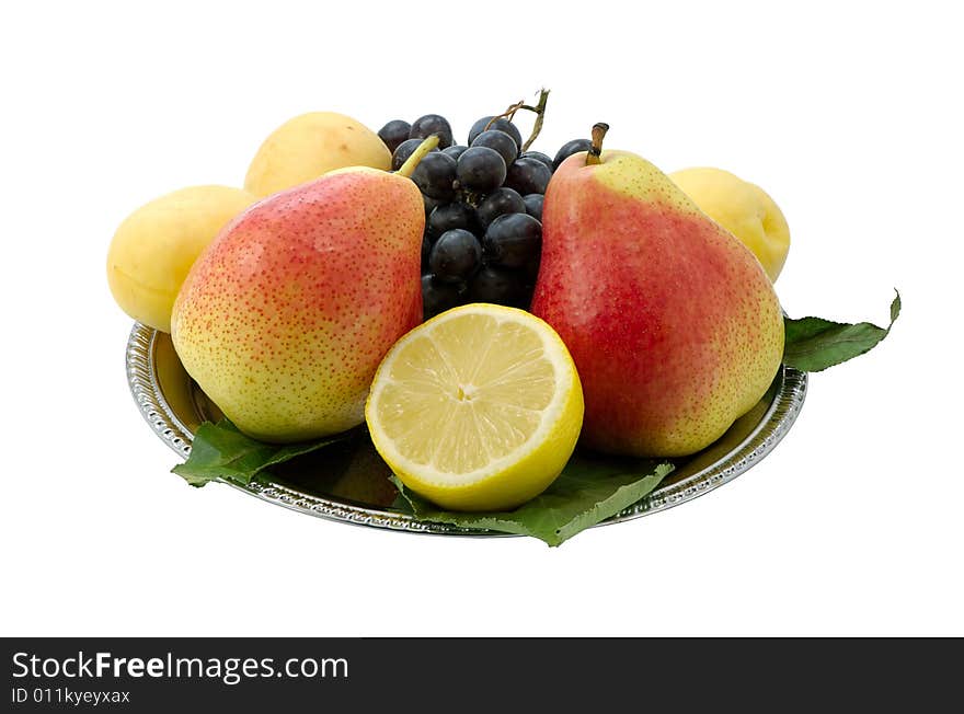 Fruit on a dish on a white background. Fruit on a dish on a white background