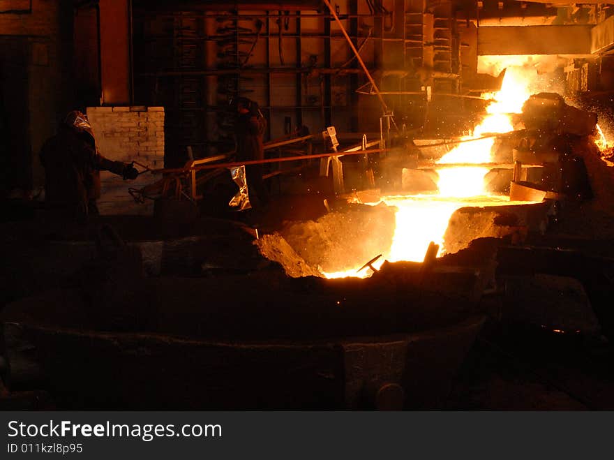 Glowing, molten hot steel. Stell casting. Glowing, molten hot steel. Stell casting.