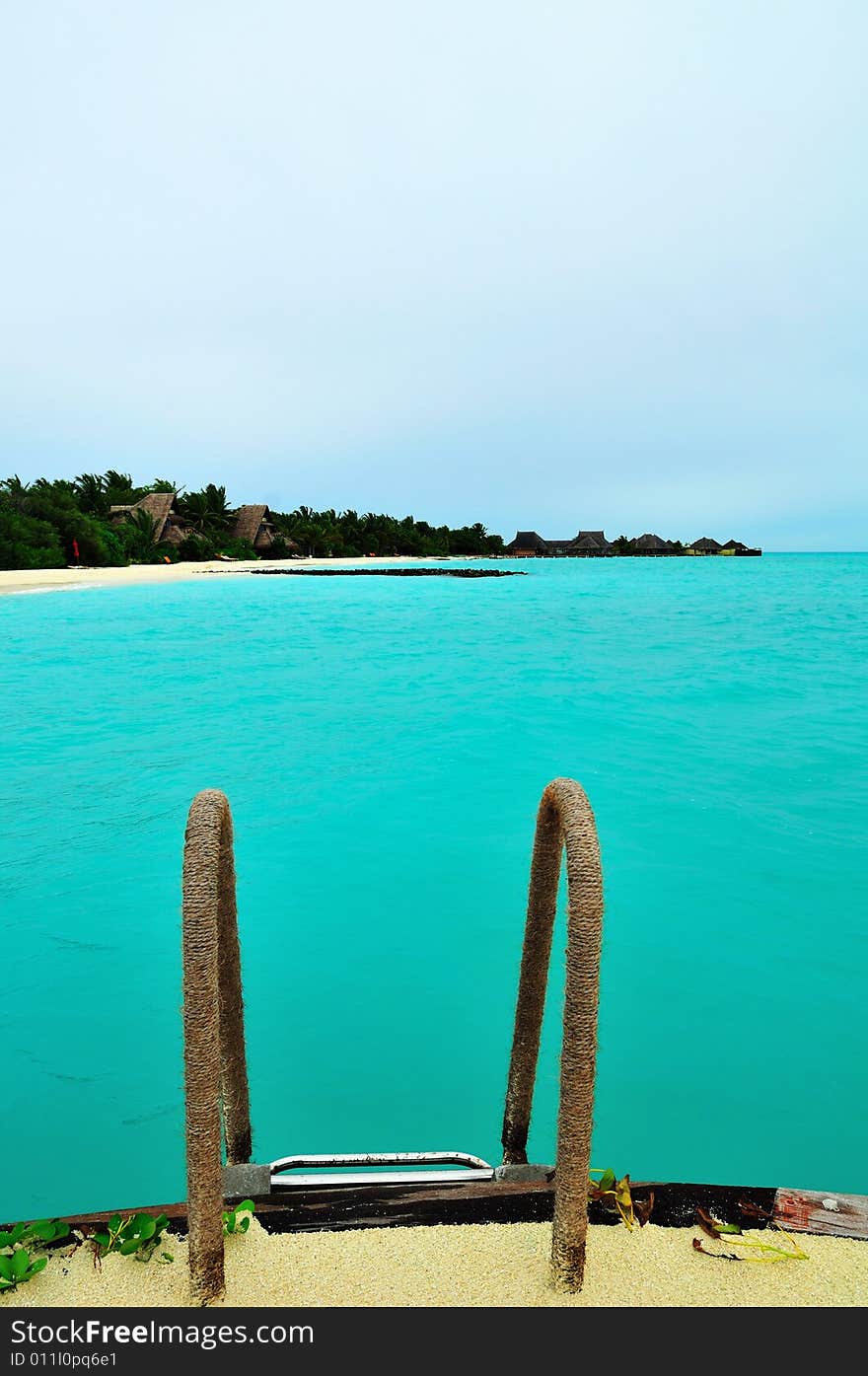 Island of Paradise. White sand beaches with coco-tree and crystal blue water. Maldives. Luxury holidays. Island of Paradise. White sand beaches with coco-tree and crystal blue water. Maldives. Luxury holidays.