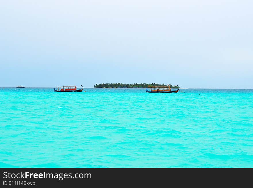 Island of Paradise. White sand beaches with coco-tree and crystal blue water. Maldives. Luxury holidays. Island of Paradise. White sand beaches with coco-tree and crystal blue water. Maldives. Luxury holidays.