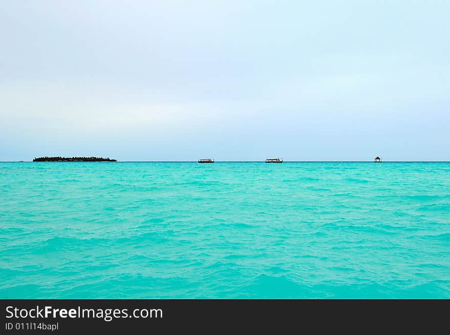 Island of Paradise. White sand beaches with coco-tree and crystal blue water. Maldives. Luxury holidays. Island of Paradise. White sand beaches with coco-tree and crystal blue water. Maldives. Luxury holidays.