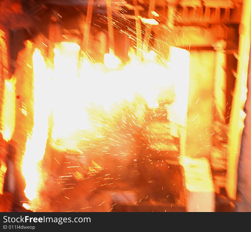 Glowing, molten hot steel. Stell casting. Glowing, molten hot steel. Stell casting.