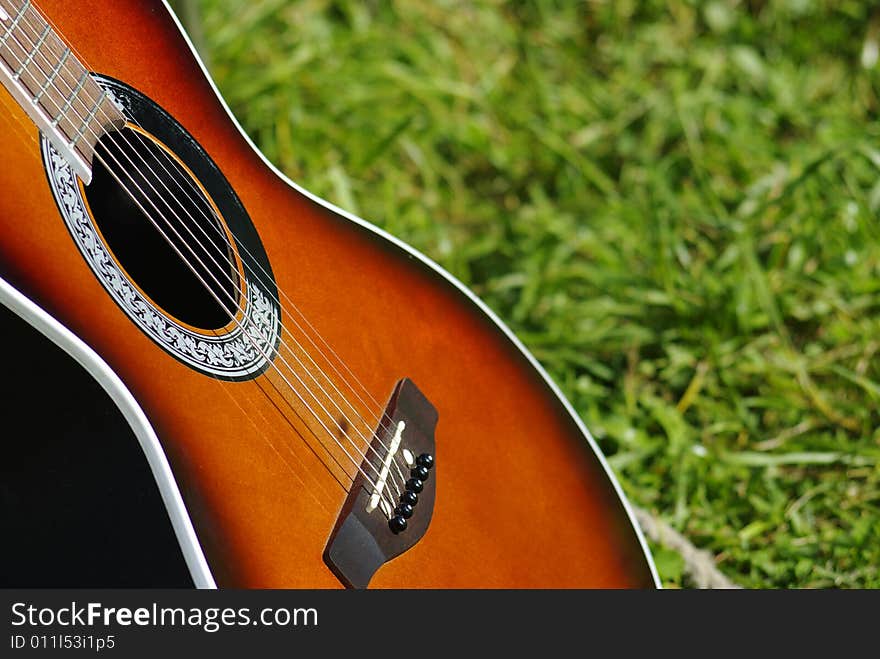 Acoustic guitar on the lawn