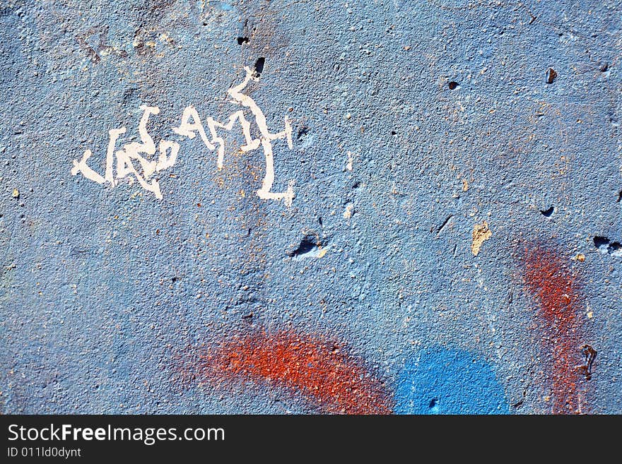 Graffiti on a wall ideal for urban or grunge background. Graffiti on a wall ideal for urban or grunge background