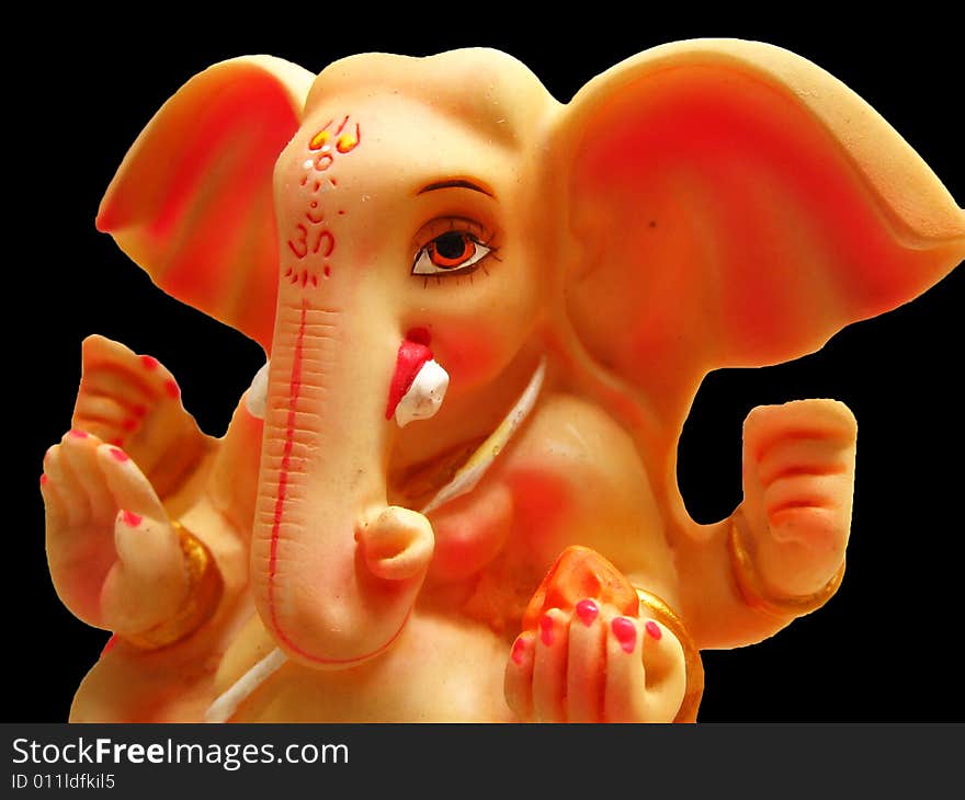 A beautifully carved idol of Lord Ganesha with huge ears, of the Hindu religion