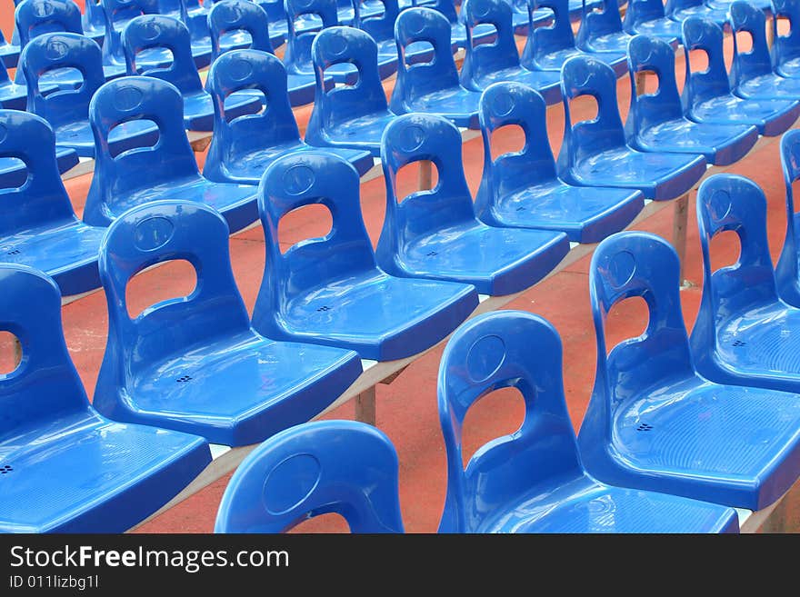 Rows of blue stadium seats