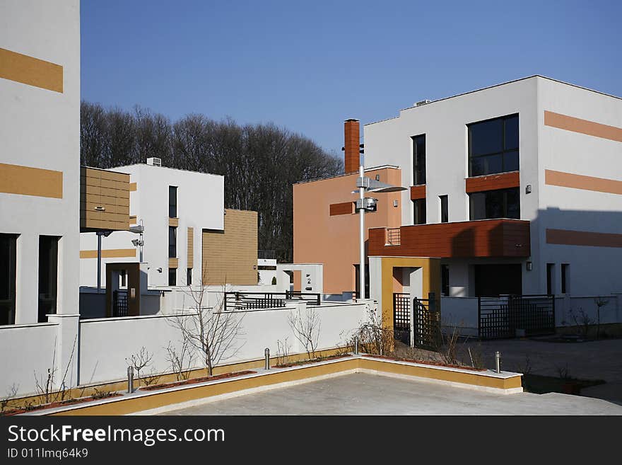 New modern white houses with blue sky. New modern white houses with blue sky.