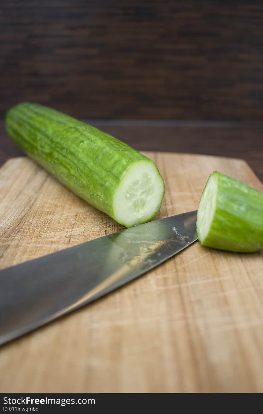 A fresh cucmama on a wooden board. A fresh cucmama on a wooden board