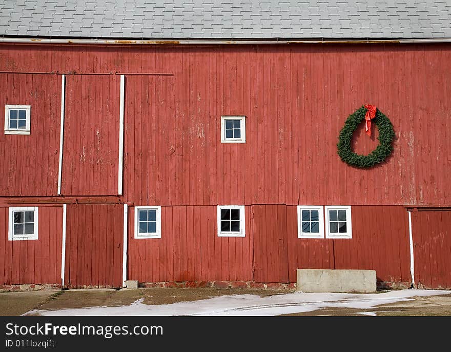 Red barn side detail with holiday wreath