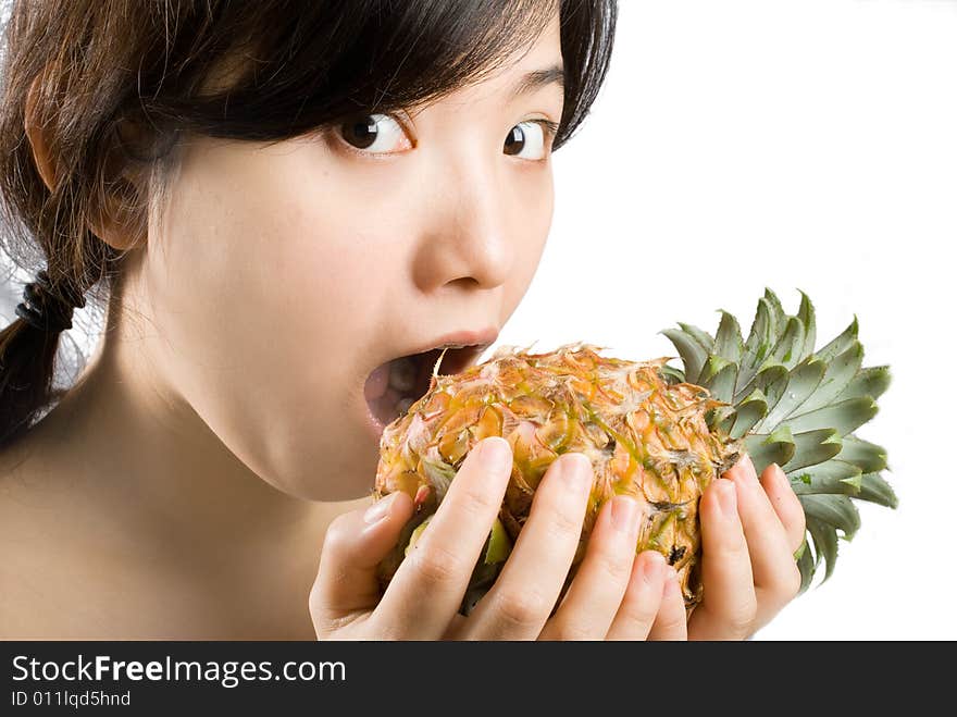 Young asian female holding a ripe and fresh pineapple. isolated picture shot in studio. Young asian female holding a ripe and fresh pineapple. isolated picture shot in studio