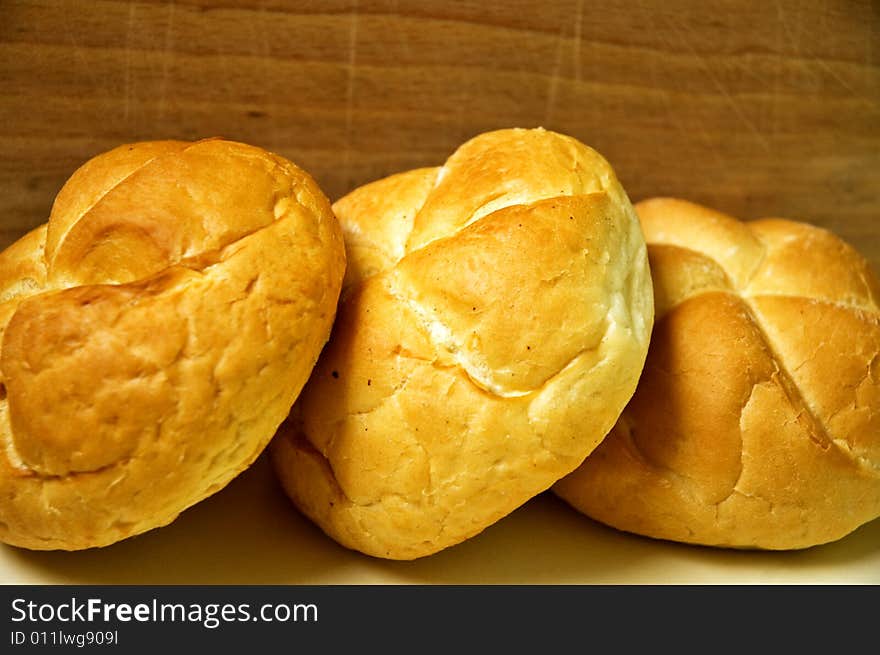 Bread roll on kitchen table.