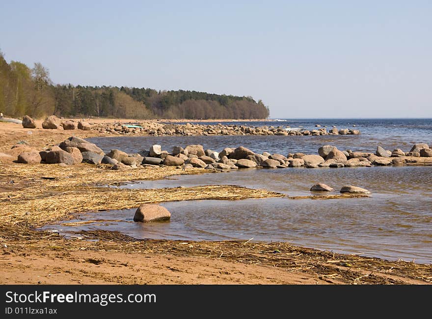 Stones on a background of the  blue sea. Stones on a background of the  blue sea