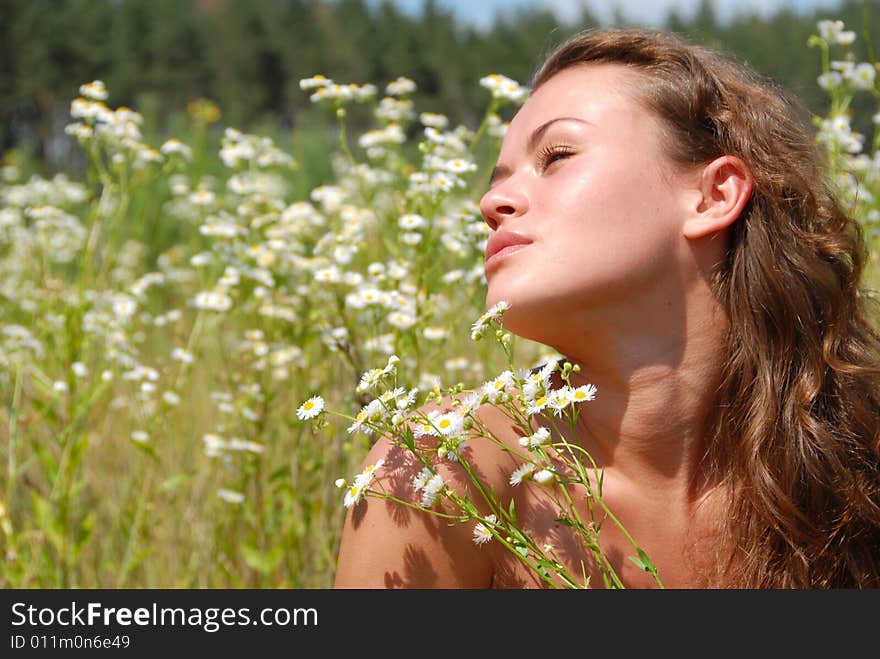 Portrait of the beautiful girl with flowers. Portrait of the beautiful girl with flowers