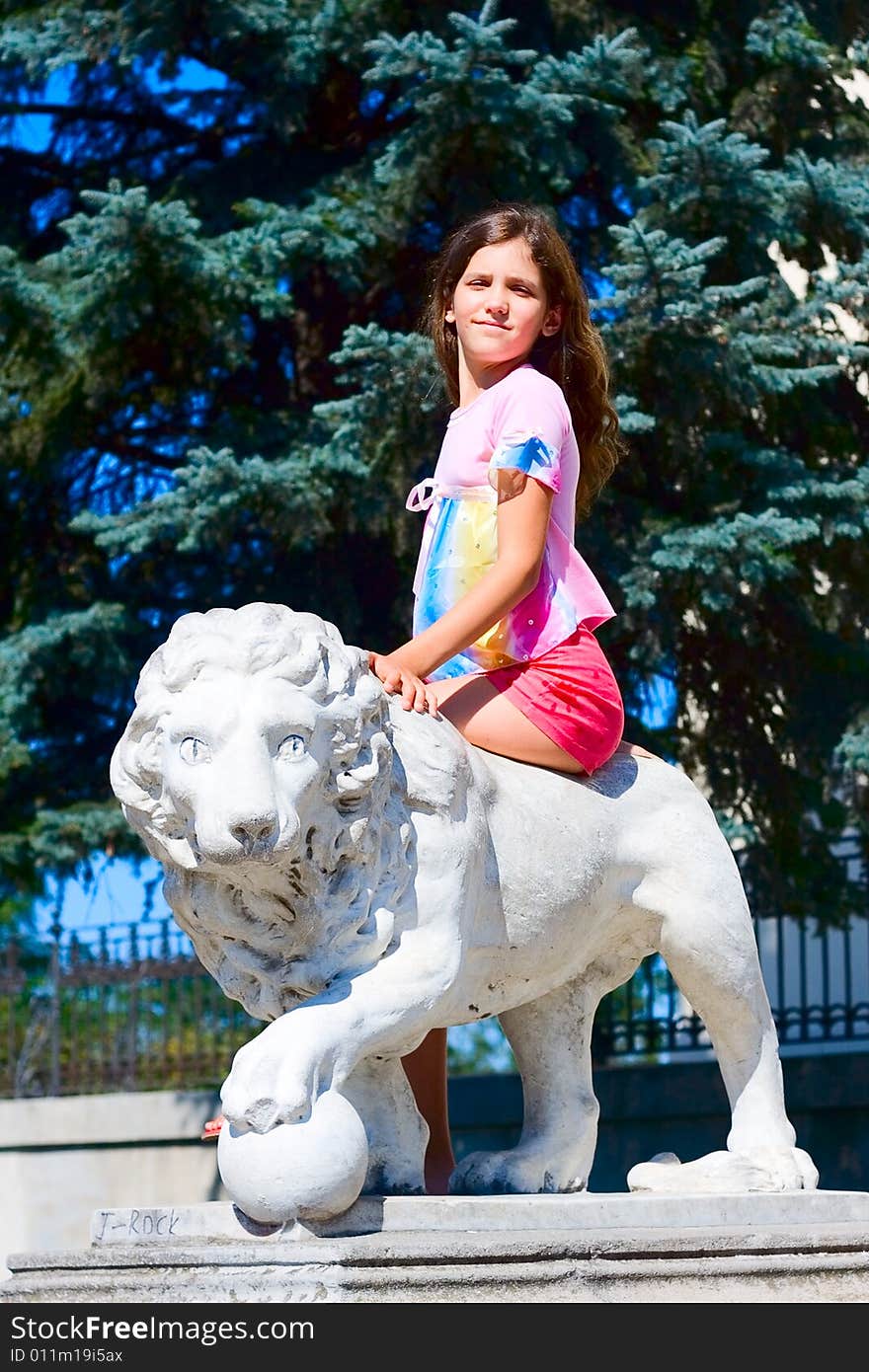 Girl on monument in park