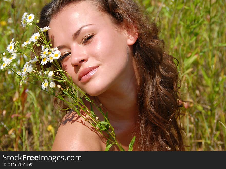 Portrait of the beautiful girl with flowers. Portrait of the beautiful girl with flowers