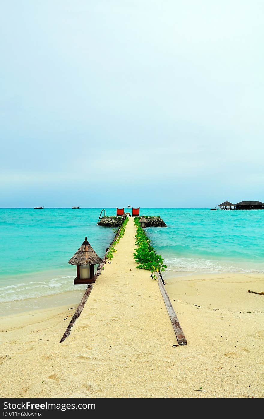 Island of Paradise. White sand beaches with coco-tree and crystal blue water. Maldives. Luxury holidays. Island of Paradise. White sand beaches with coco-tree and crystal blue water. Maldives. Luxury holidays.