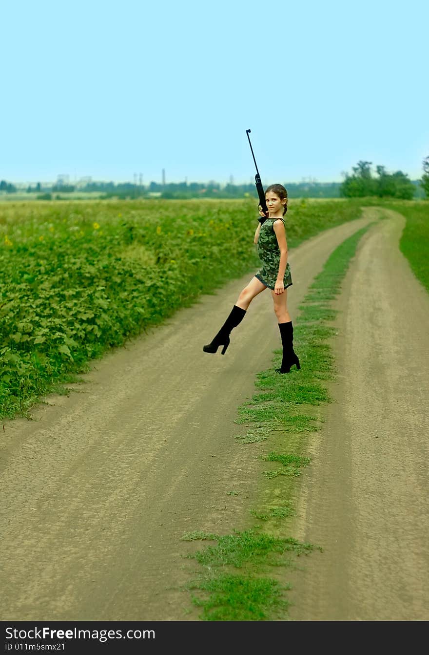 Girl with gun on road