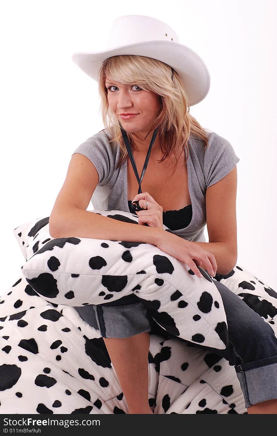 Studio shot of blond hair girl with white cowboy hat. Studio shot of blond hair girl with white cowboy hat.