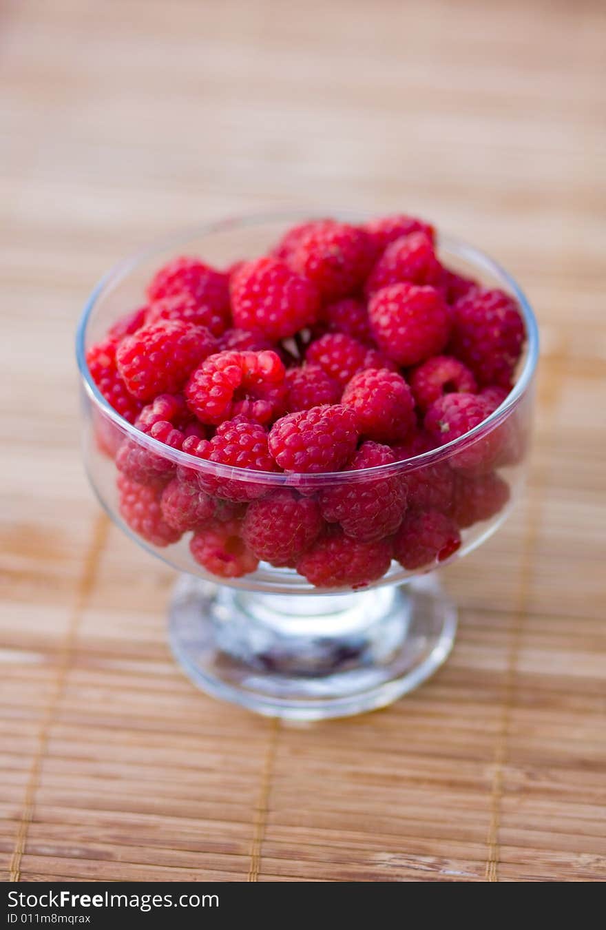 Raspberry in a transparent cup