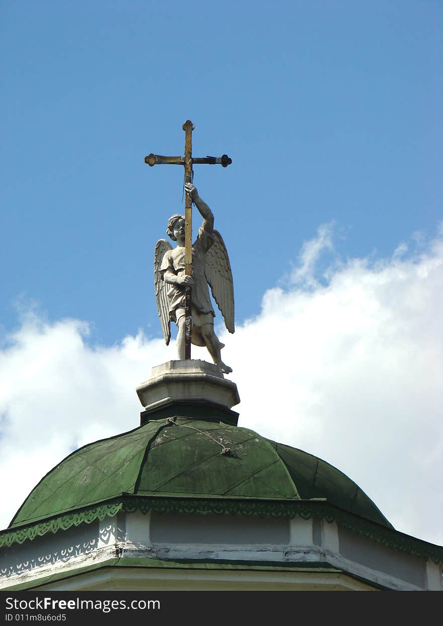 Angel with a cross on a dome church