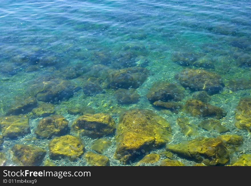 Stones in a transparent sea