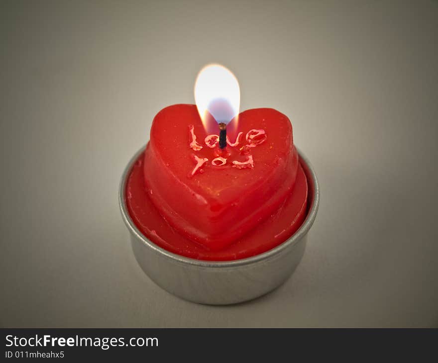 Red candle with an inscription, isolated. Red candle with an inscription, isolated