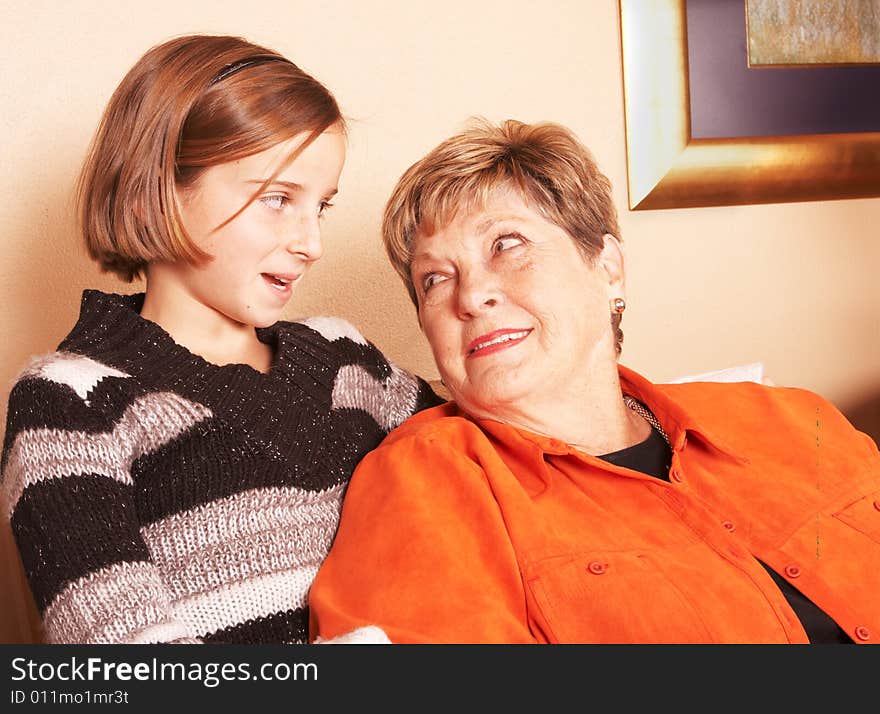 Grandmother and granddaughter look each other