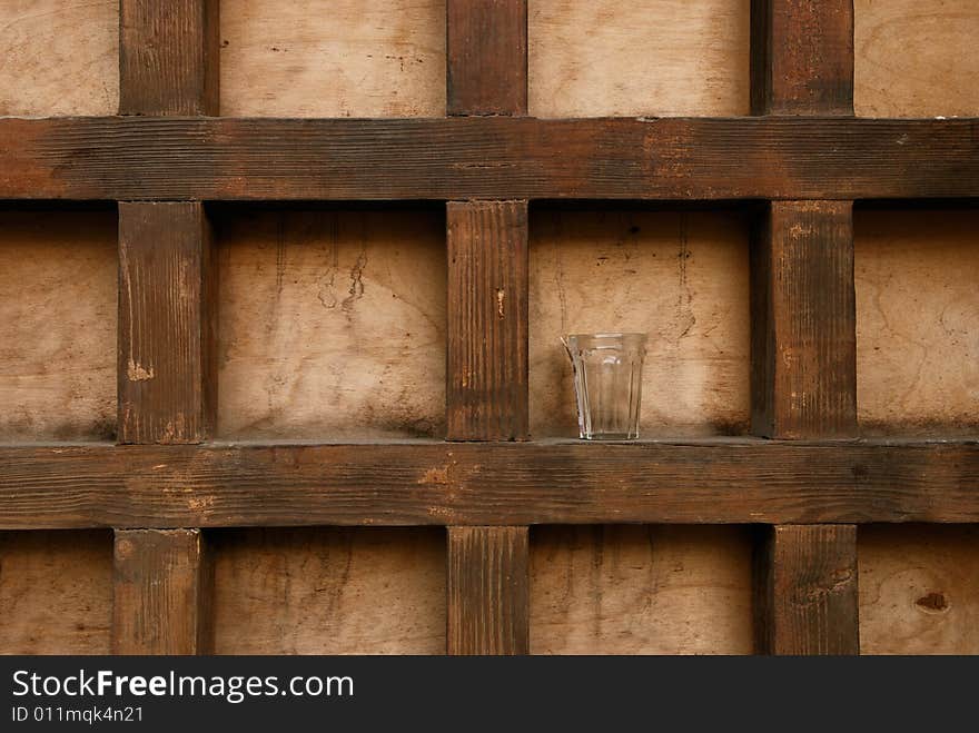 Glass on the wooden background