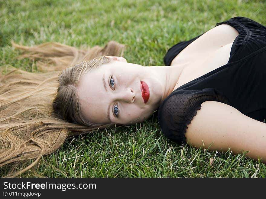 Young girl on green lawn