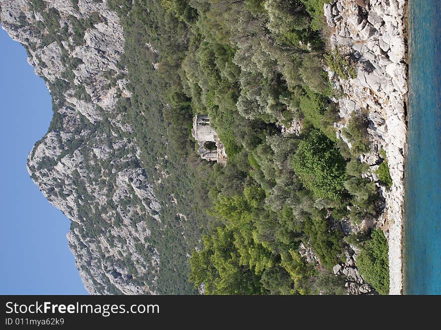 Ancient church on hillside near sea