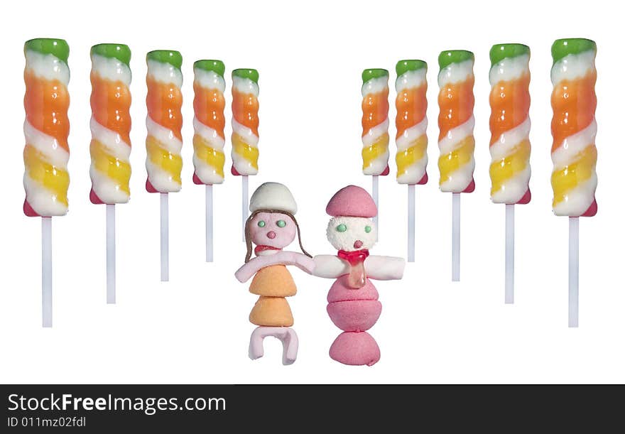 A couple of candy people in the middle of several lollipop sticks in a perspective disposition over white background. A couple of candy people in the middle of several lollipop sticks in a perspective disposition over white background.