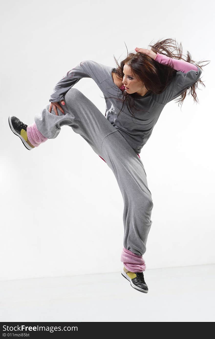 Cool looking dancer posing on a white background. Cool looking dancer posing on a white background