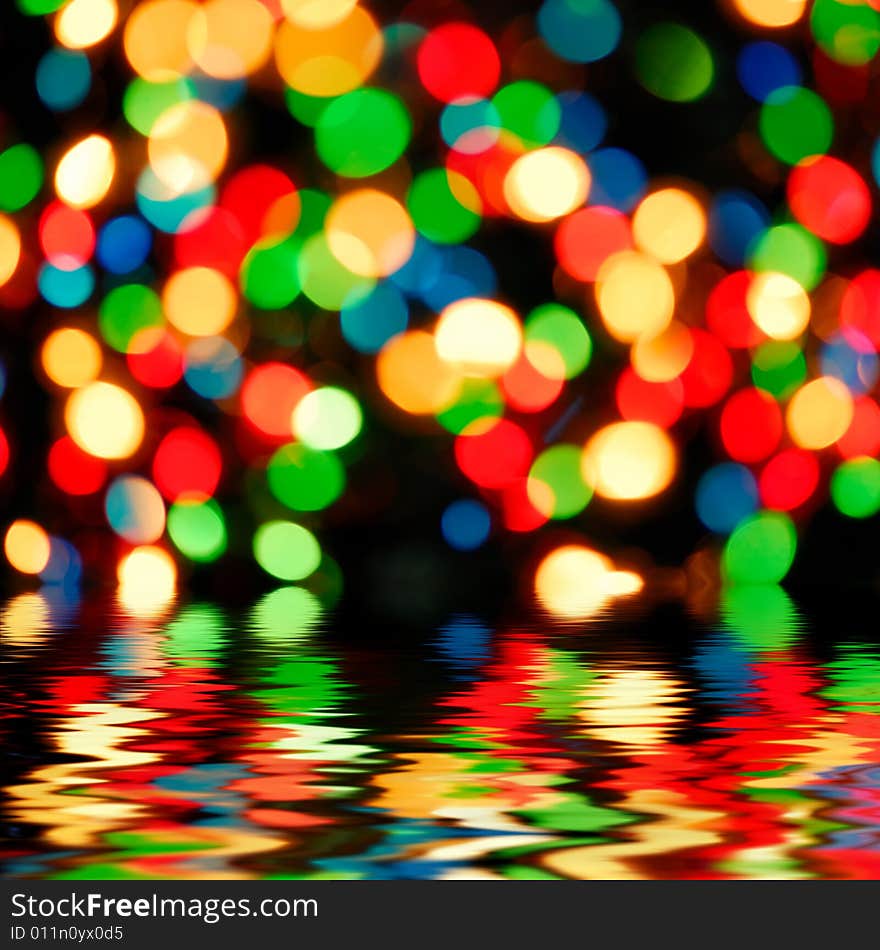 Abstract background - color lights with reflection in water