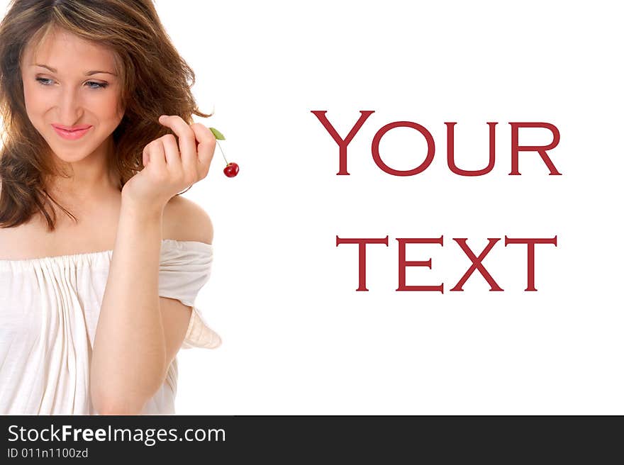 Studio shot - portrait of a beautiful young girl holding a cherry in her hand on pure white background with empty space for your text.